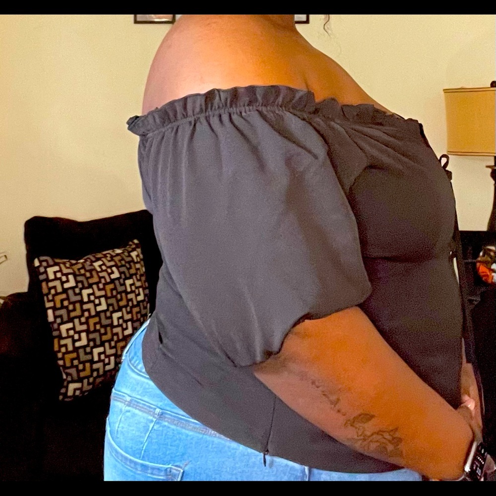 Black off the shoulder top. NEVER WORN!
